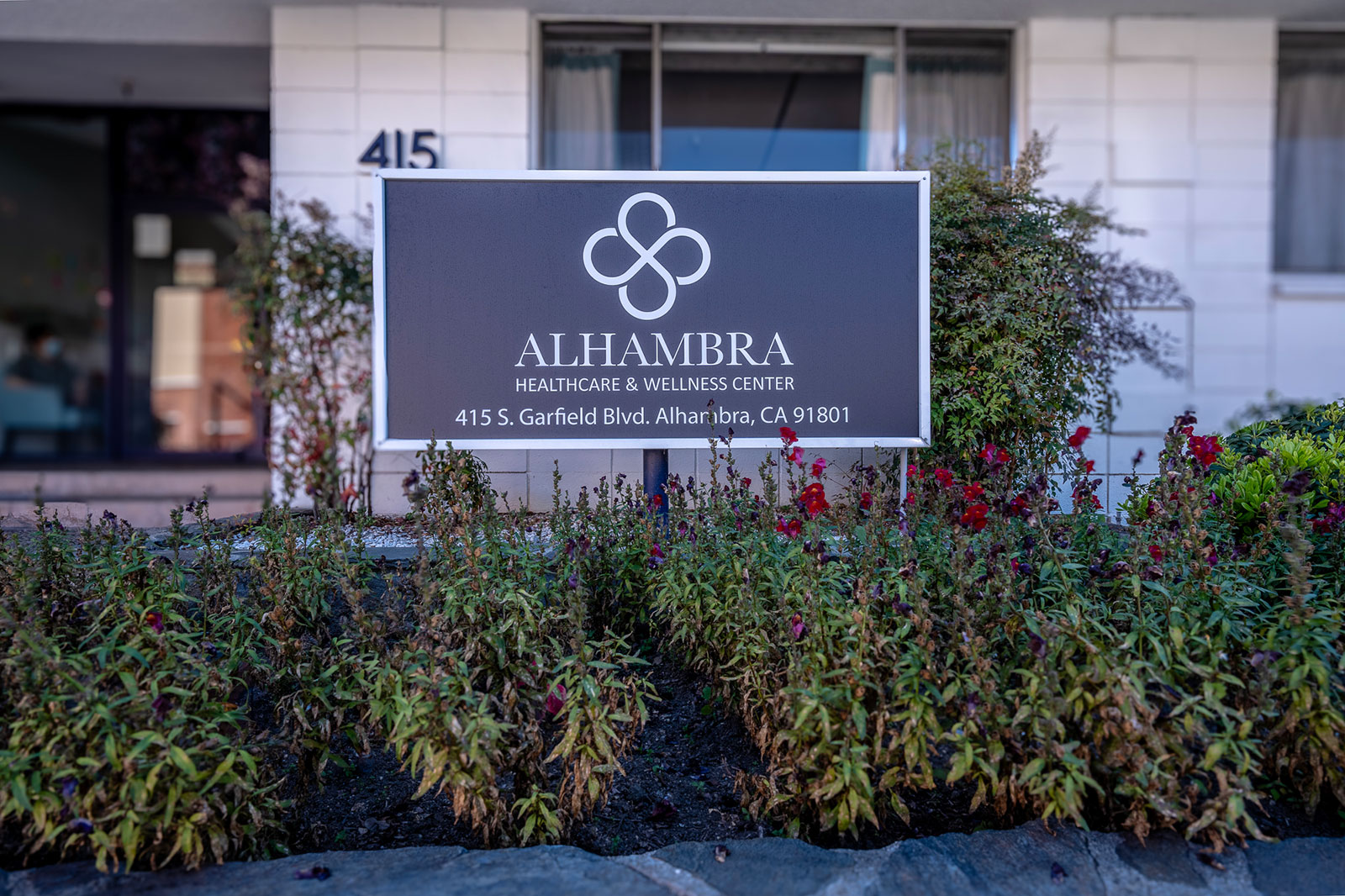 Front of building with sign at Alhambra